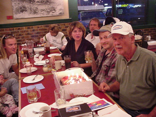 Tom far left with long hair